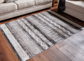 Sectionals for Less - Ashley Furniture - Henchester Rug - 8' x 10' Washable Rug / Multi - R405991