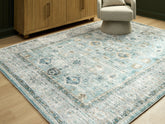 Sectionals for Less - Ashley Furniture - Ladstoney Rug - 5' x 7' Area Rug / Teal/Beige/Ochre - R407502