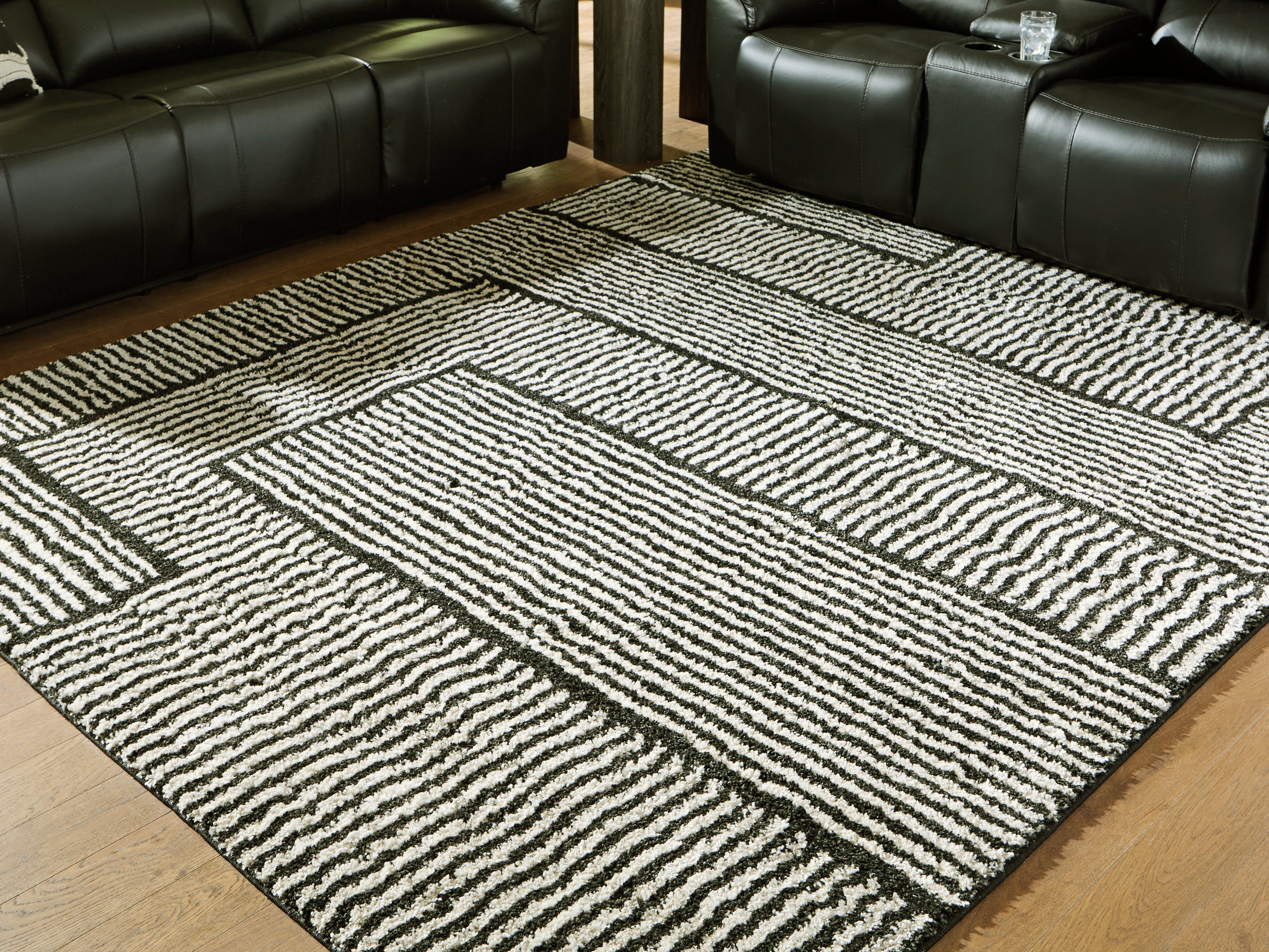 Sectionals for Less - Ashley Furniture - Kurtmen Rug - 5' x 7' Area Rug / Black/Ivory - R407592