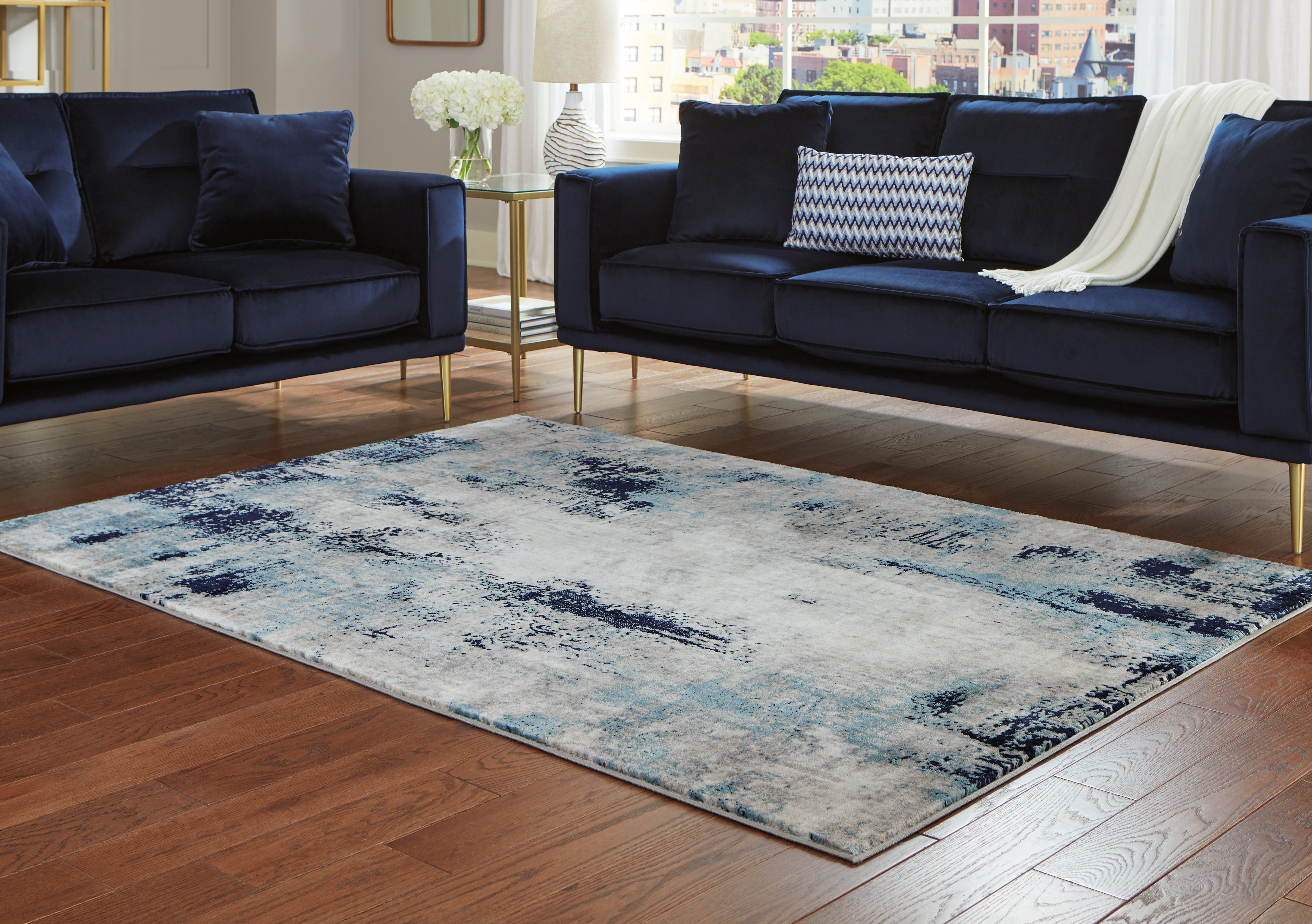Sectionals for Less - Ashley Furniture - Leonelle Rug - 7'10" x 10' Rug / White/Blue/Gray - R404871