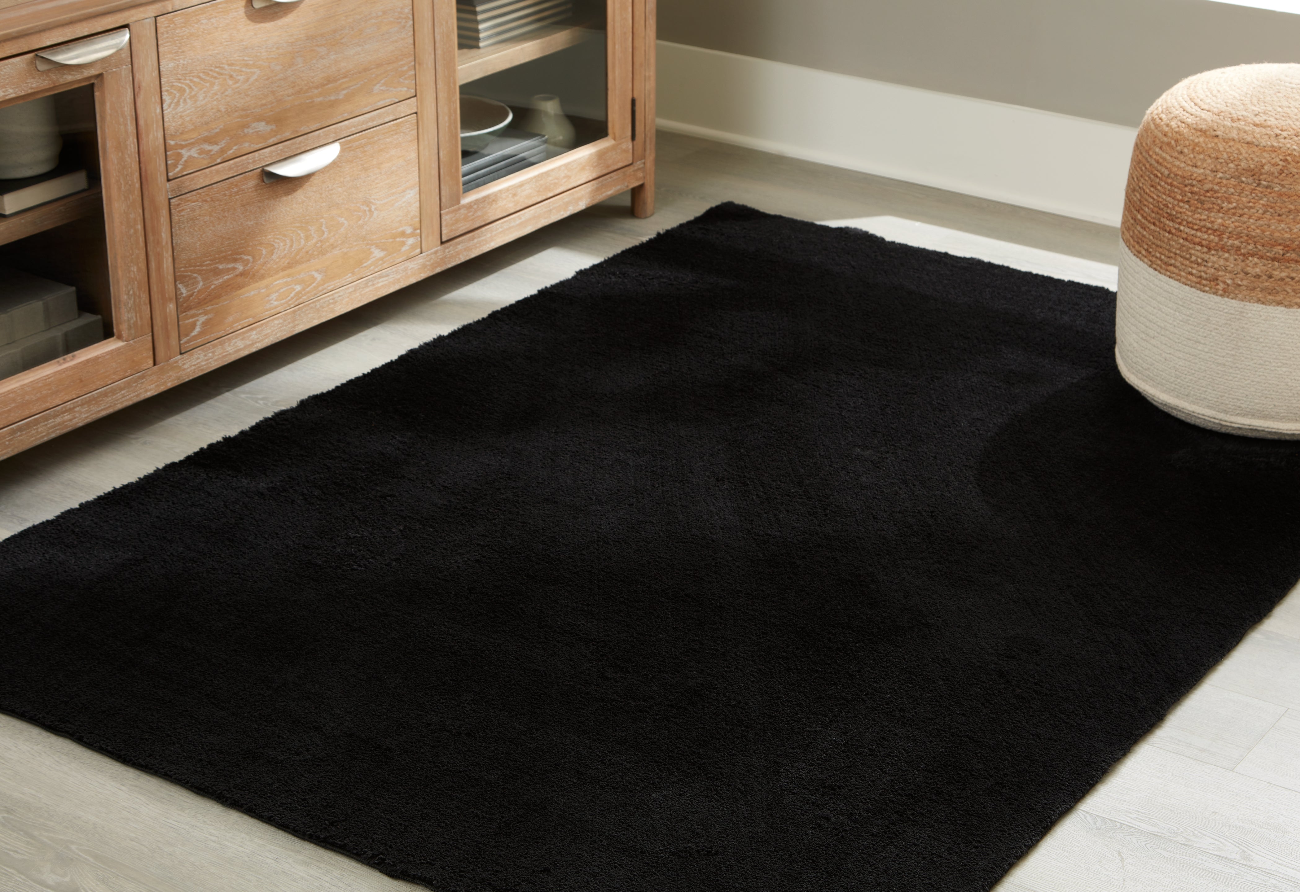 Sectionals for Less - Ashley Furniture - Anaben Rug - 5' x 7' Washable Rug / Black - R406312