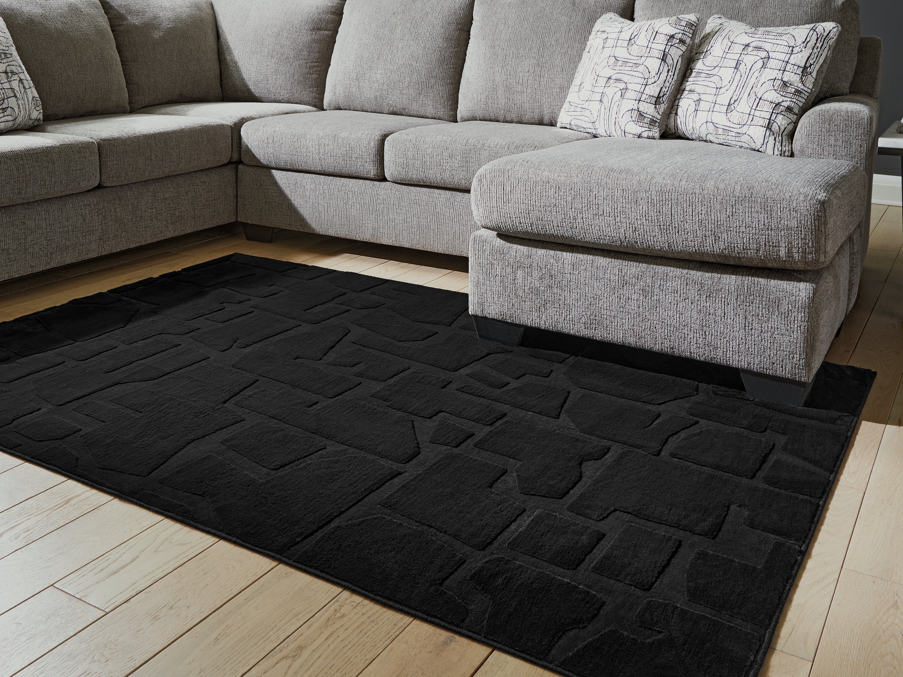 Sectionals for Less - Ashley Furniture - Gibbswell Rug - Washable 5' x 7' Area Rug / Black - R407462