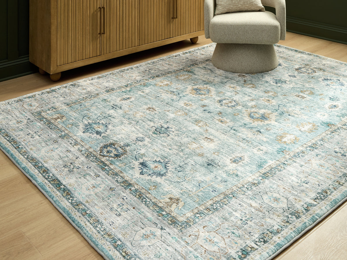 Sectionals for Less - Ashley Furniture - Ladstoney Rug - 5' x 7' Area Rug / Teal/Beige/Ochre - R407502