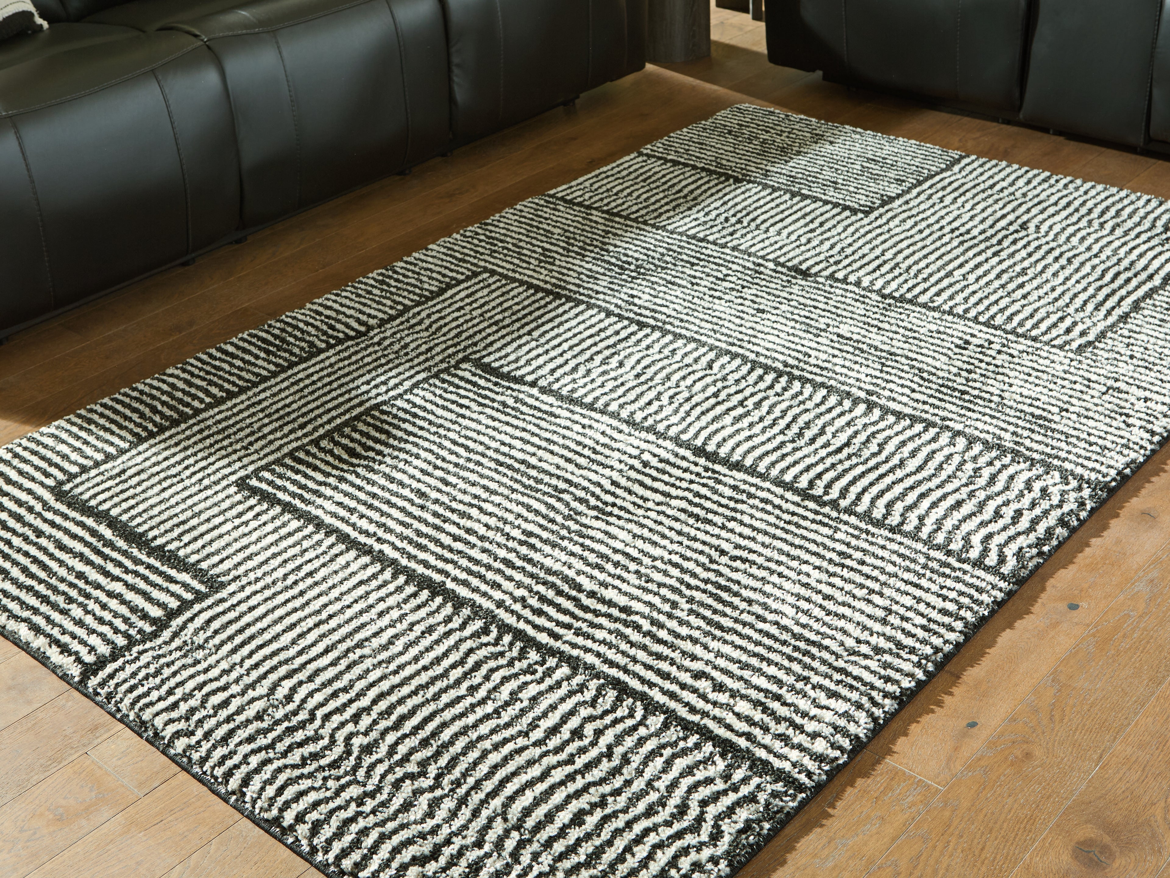 Sectionals for Less - Ashley Furniture - Kurtmen Rug - 5' x 7' Area Rug / Black/Ivory - R407592