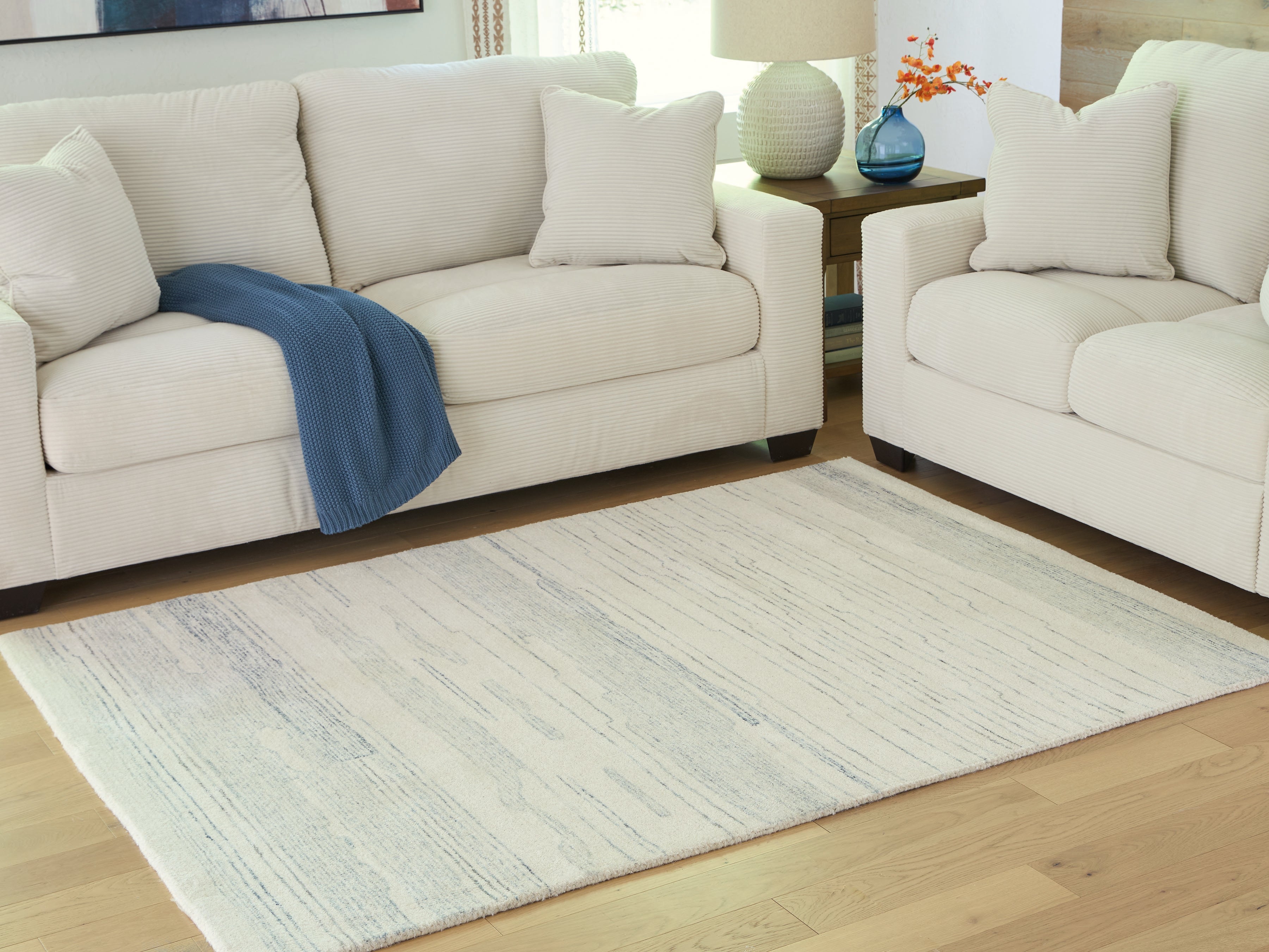 Sectionals for Less - Ashley Furniture - Genemost Rug - 5' x 7' Area Rug / Ivory/Blue - R407842