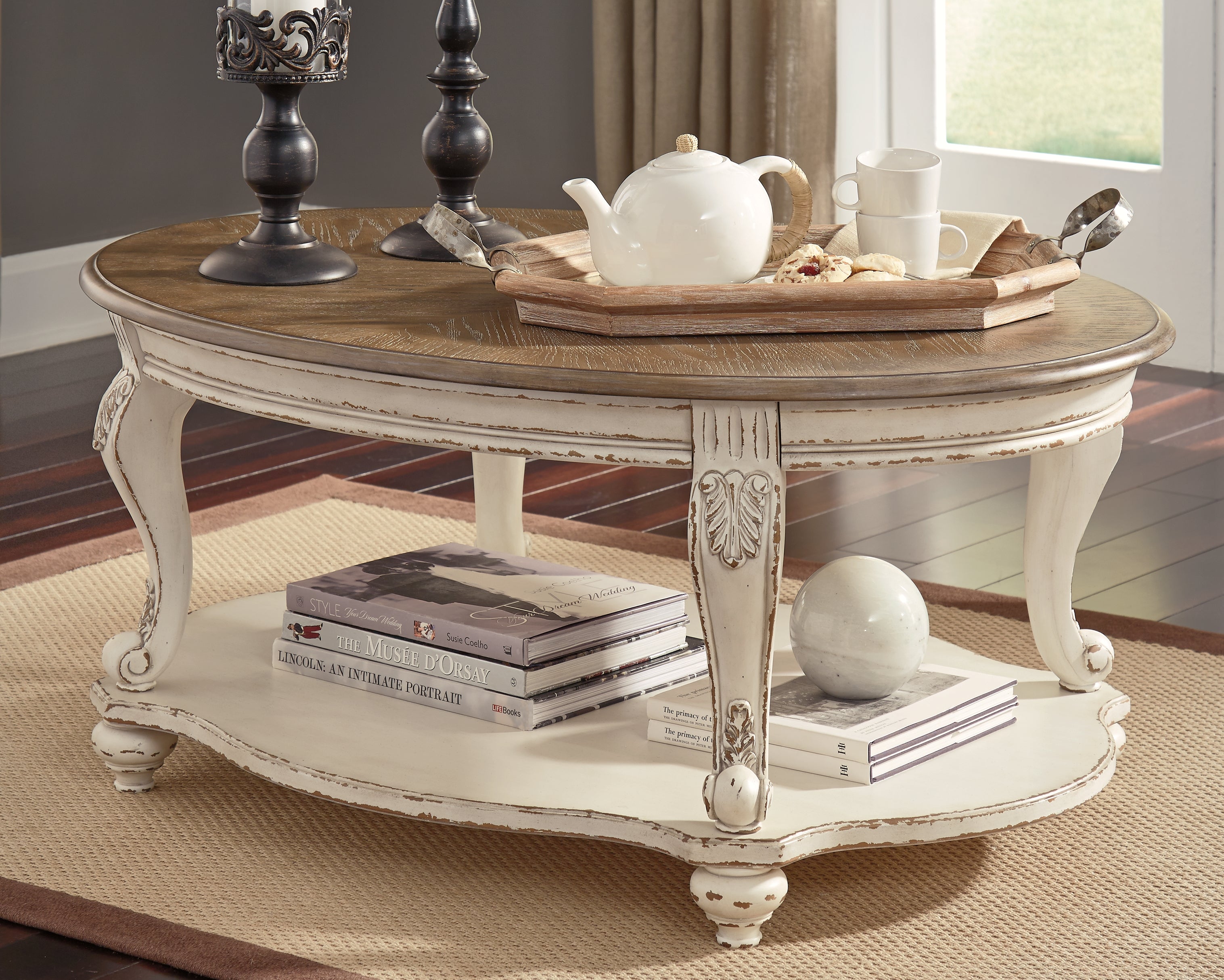 Sectionals for Less - Ashley Furniture - Realyn Coffee Table - Oval Cocktail Table / White/Brown - T743-0