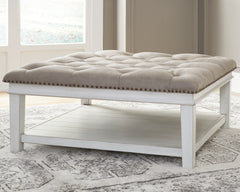 Sectionals for Less - Ashley Furniture - Kanwyn Upholstered Ottoman Coffee Table - UPH Ottoman Cocktail Table / Whitewash - T937-21